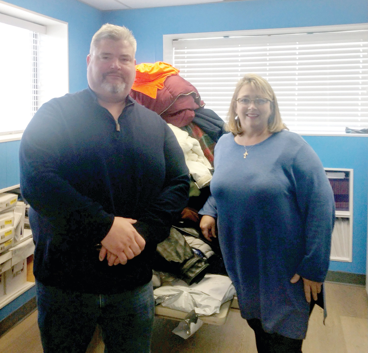 On January 14, Knights of Columbus Council 1738 donated gently used winter coats to the St. Vincent DePaul Society, Cranston. Pictured, council 1738 Grand Knight Scott Roche presenting the coats to the St. Vincent DePaul Executive Director Renee Brissette.